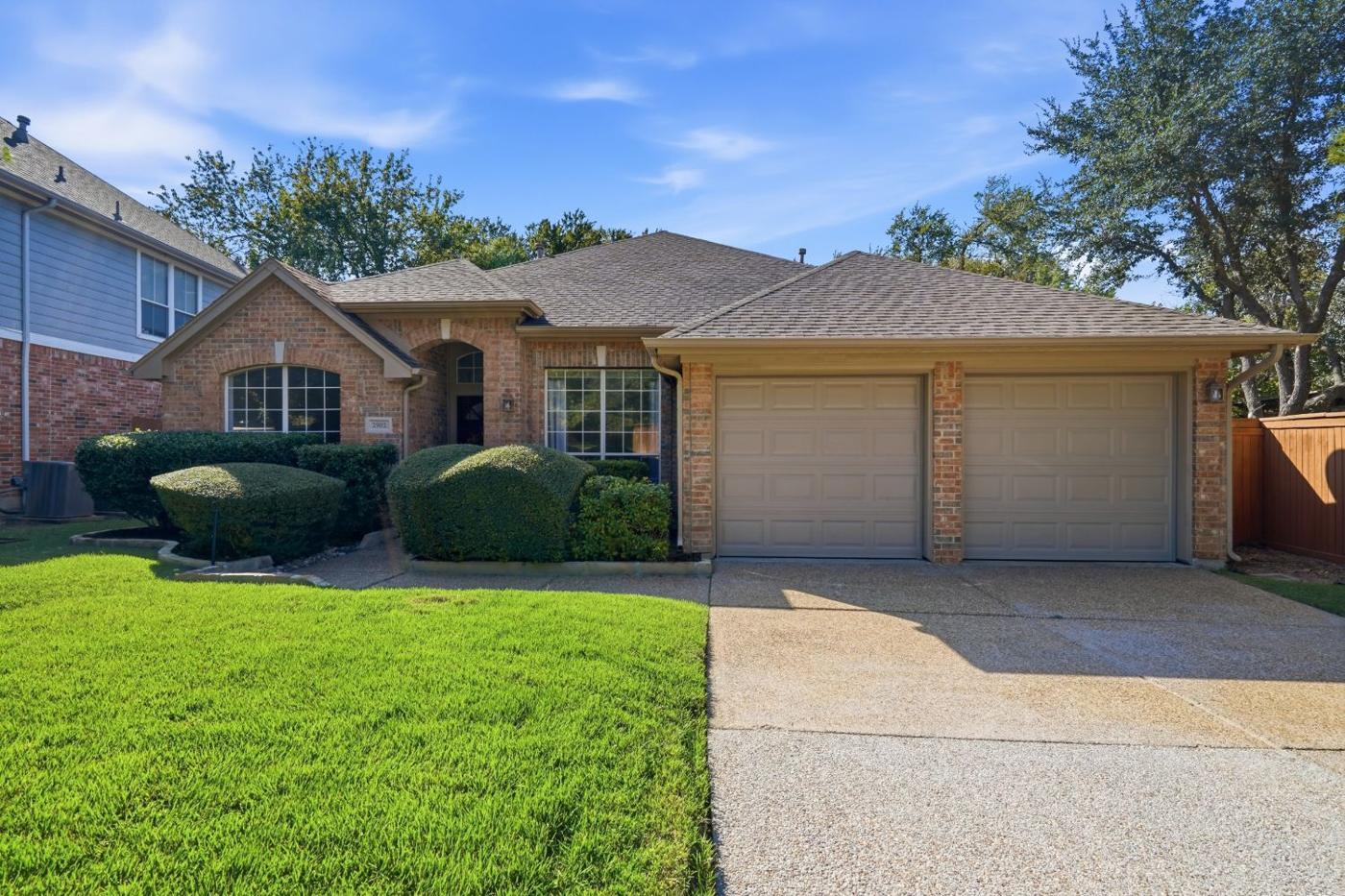Brick single-story home with two-car garage on a cul-de-sac