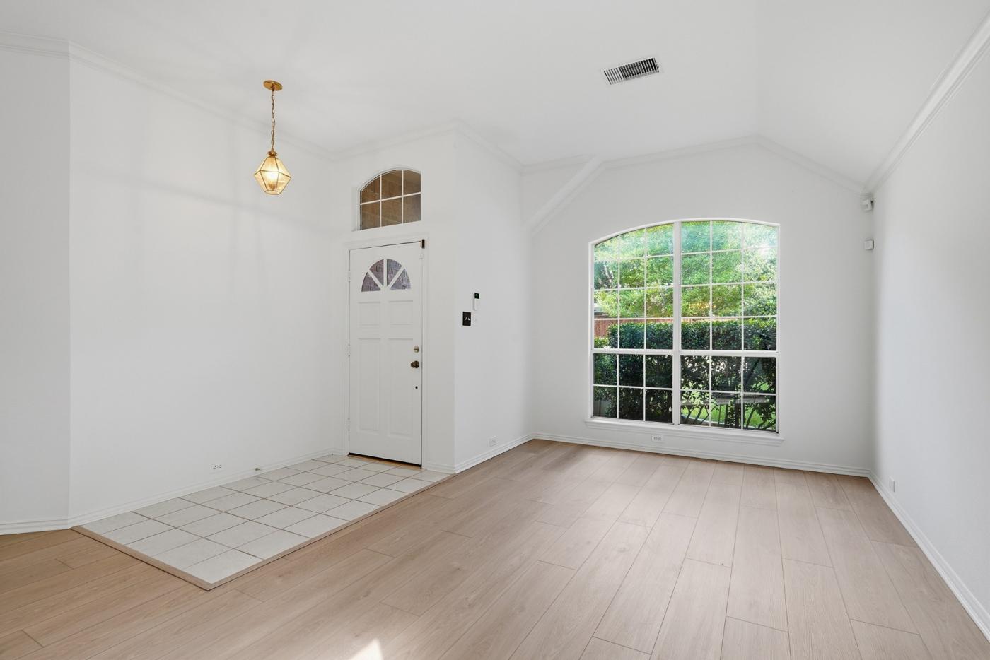 Entry with arched transom window and arched front window