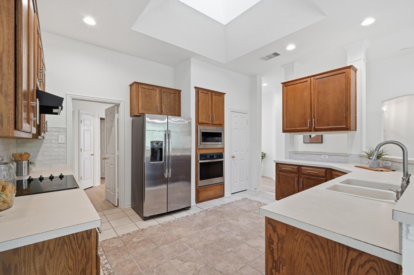 Kitchen with built-in oven and microwave